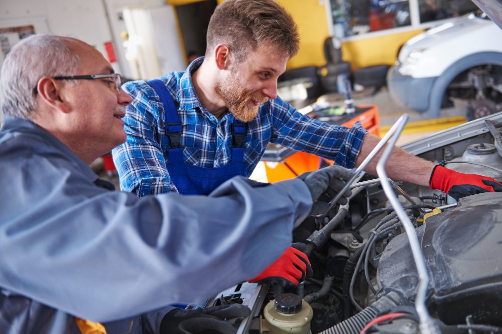 mechanics are repairing car